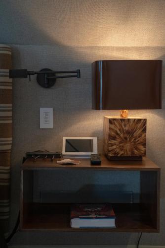 a desk with a lamp and a computer on it at Public House Lofts in Crested Butte