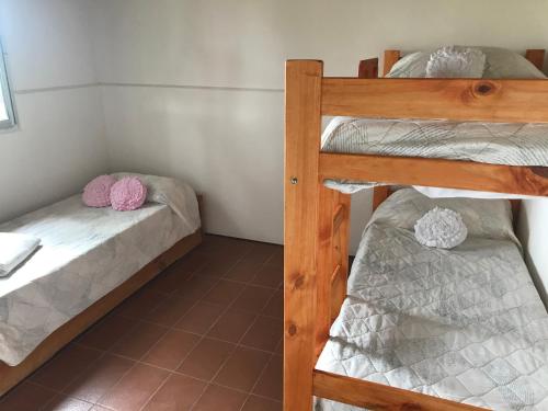 two bunk beds in a small room at La Soñada in Lobos