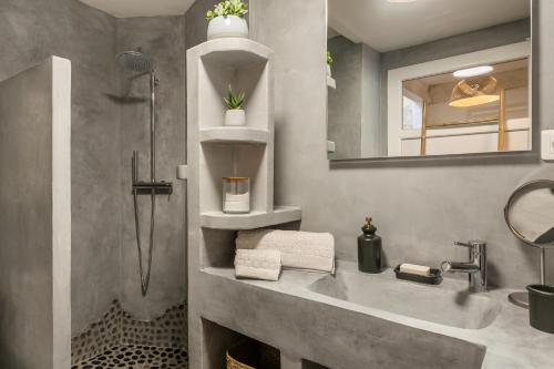 a bathroom with a sink and a shower at My Pad Provence 6 in Avignon