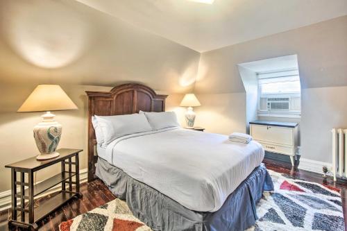 a bedroom with a large bed and two tables with lamps at Walk to Shops, Dining and City Park Reading Apt in Reading
