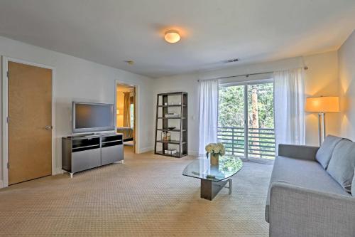 a living room with a couch and a tv at LoHi Apartment with Patio 1 Mi to Downtown Denver! in Denver