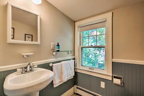 een badkamer met een wastafel en een raam bij Cape Cod House with Grill and Yard - Drive to Beach! in South Yarmouth
