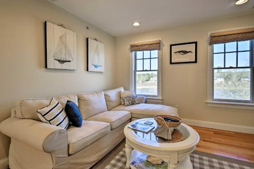 a living room with a couch and a table at 1 Mi to Town and Oyster Pond Beach Chatham Retreat in Chatham