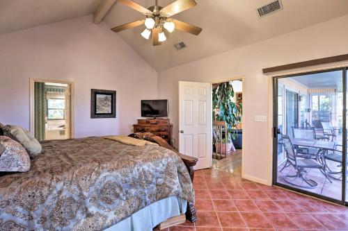 a bedroom with a bed and a ceiling fan at Secluded Home - Canyon Lake View Near Boat Launch! in Canyon Lake