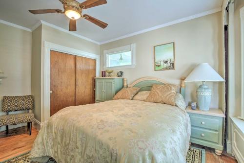 a bedroom with a bed and a ceiling fan at Quaint Beverly Townhome Walk to Beach and Downtown! in Beverly