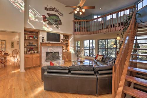 a living room with a couch and a fireplace at Secluded Home - Canyon Lake View Near Boat Launch! in Canyon Lake