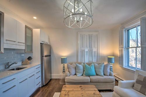 a living room with a couch and a kitchen at Walk to Attractions Couples Retreat in Nantucket in Nantucket