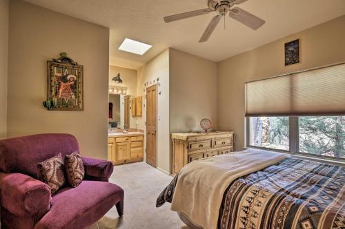 a bedroom with a bed and a chair and a bathroom at 1 Mi to Santa Fe Plaza Quiet Home with Patio in Santa Fe