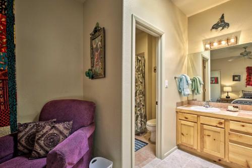 a bathroom with a purple chair and a sink at 1 Mi to Santa Fe Plaza Quiet Home with Patio in Santa Fe