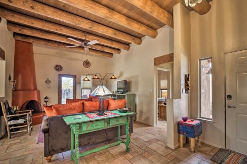 a living room with a couch and a table at 1 Mi to Santa Fe Plaza Quiet Home with Patio in Santa Fe