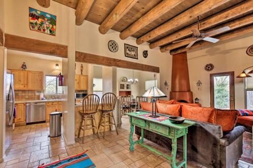 a living room with a couch and a table at 1 Mi to Santa Fe Plaza Quiet Home with Patio in Santa Fe