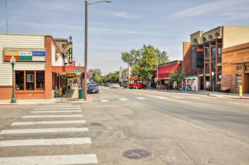 an empty street in a small town with a crosswalk at Lake Pend Oreille Condo with Porch and Mountain View! in Sandpoint