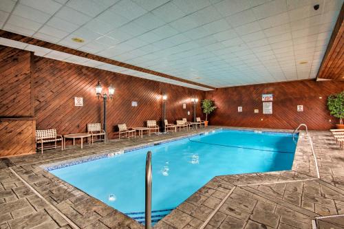 a large swimming pool in a hotel room at Hike, Ski, Explore Lincoln Condo with Pool Access in Lincoln
