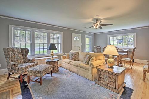 a living room with a couch and a table at Beautiful Lenox Home, 3 Mi to Shakespeare and Co! in Lenox