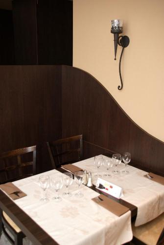 a table with wine glasses on top of it at Charly's Gare in Senningerberg