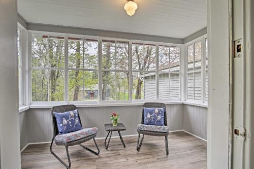two chairs and a table in a room with windows at Beautiful Lenox Home, 3 Mi to Shakespeare and Co! in Lenox