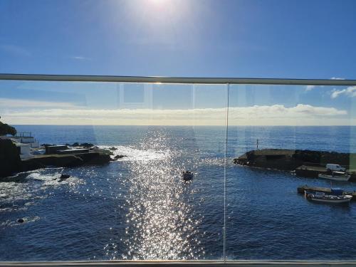 a view of a body of water from a window at Casa Verde-Porto dos Carneiros in Lagoa