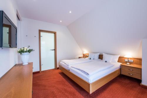 Katil atau katil-katil dalam bilik di Hotel Hanses-Bräutigam