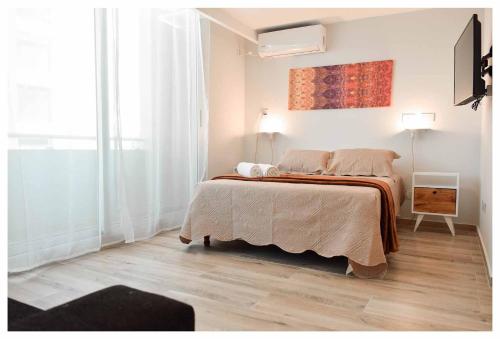 Un pat sau paturi într-o cameră la Rent Nuñez 2830
