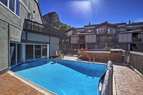 a large swimming pool in front of a building at Creekside Frisco Condo with Views and Pool Access! in Frisco