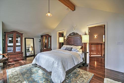 a bedroom with a large bed with a wooden headboard at Luxurious South Lake Tahoe Lodge Less Than 2 Mi to Lake! in South Lake Tahoe