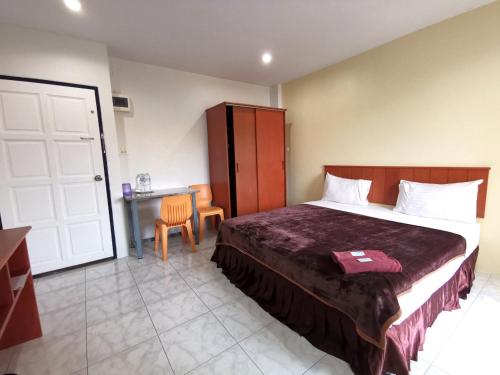 Ένα ή περισσότερα κρεβάτια σε δωμάτιο στο Ban Kaew Guesthouse Songkhla
