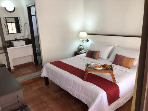Кровать или кровати в номере Hotel Antigua Posada