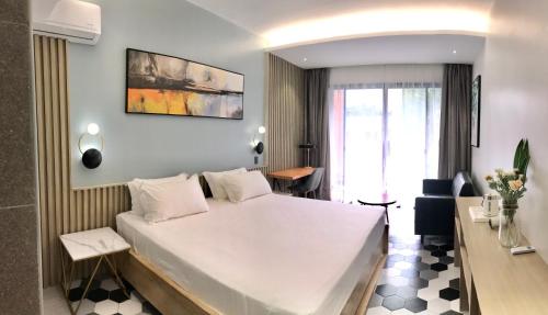 Un ou plusieurs lits dans un hébergement de l'établissement Only Seed Resort 欧芮希度假酒店