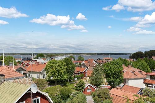 a view of a town with houses and trees at Sands Hotell in Sandhamn