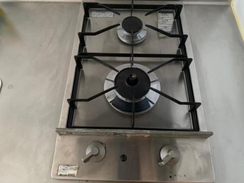 a stove top with two knobs on top of it at OUCHI HOTEL Higashi-Hiratsuka #301 in Hiroshima