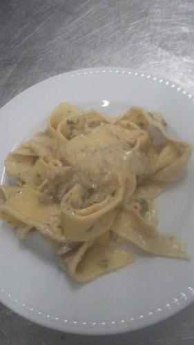 a plate of pasta on a white plate at Agriturismo La Vallata in Masseria Scilva