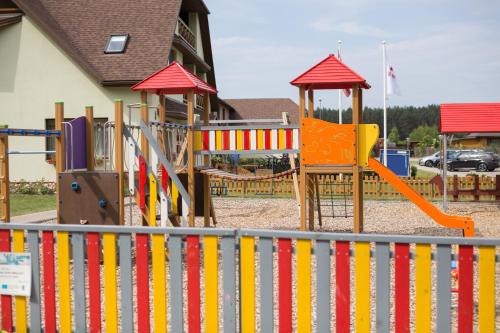 a park with a playground with a slide at Irbēni in Brivkalni