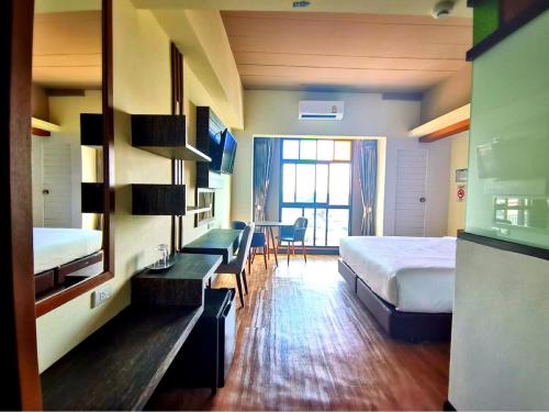 Katil atau katil-katil dalam bilik di PS Thungsao Hotel