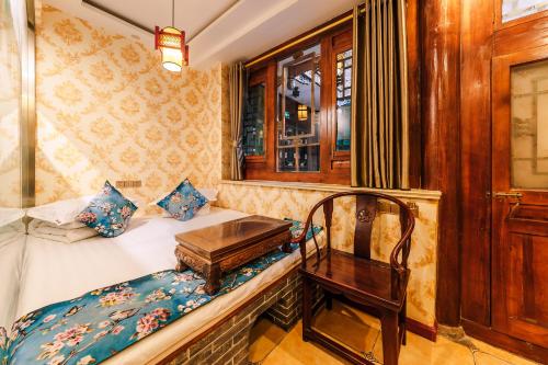 Postel nebo postele na pokoji v ubytování Pingyao HongJingYuanGuesthouse