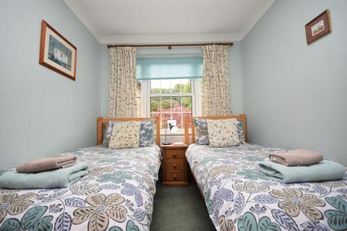 Tempat tidur dalam kamar di Birch End, Midhurst