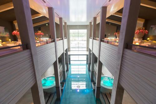an overhead view of a bathroom with two sinks and mirrors at Hotel & Wellness Zuiver in Amsterdam