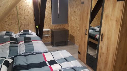 Postel nebo postele na pokoji v ubytování Chata Tanvaldský Špičák