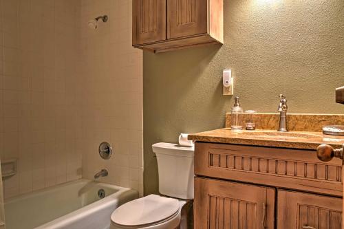 a bathroom with a toilet and a sink and a tub at Eagles Nest Crested Butte Townhome with Mtn Views in Crested Butte