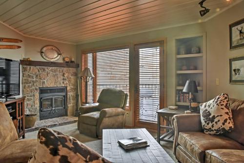 a living room with a couch and a fireplace at Eagles Nest Crested Butte Townhome with Mtn Views in Crested Butte