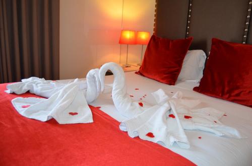 En eller flere senge i et værelse på Hotel Torres Novas