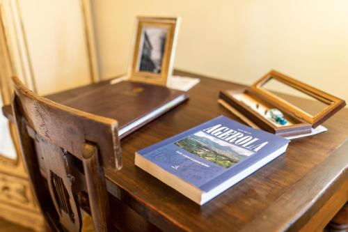 a wooden desk with a book on top of it at Palazzo Lauritano in Agerola
