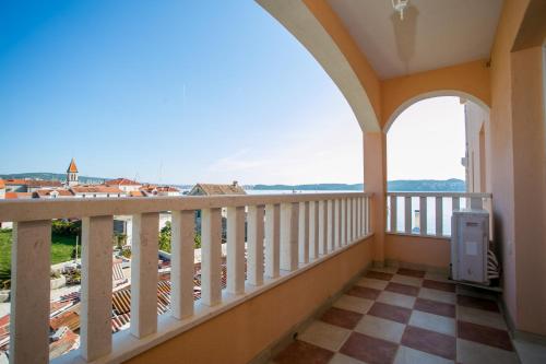 a balcony with a view of the ocean at Kaja - right next to the beach in Trogir