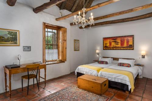 Ένα ή περισσότερα κρεβάτια σε δωμάτιο στο Oude Wellington Estate