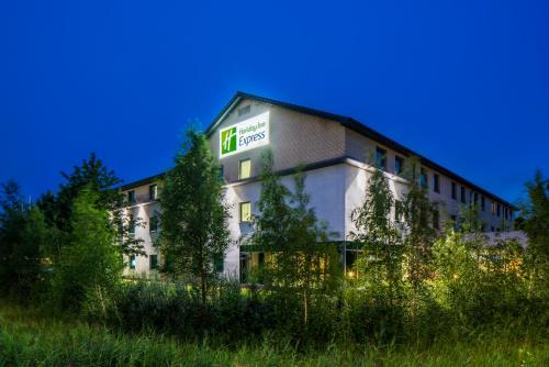 a building with a sign on the side of it at Holiday Inn Express Doncaster by IHG in Doncaster
