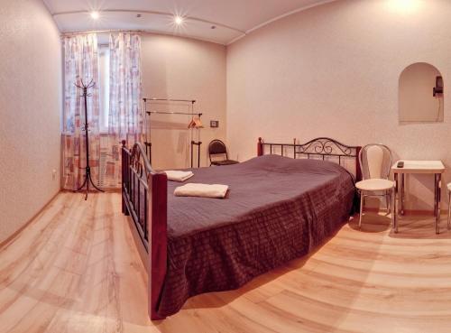 Säng eller sängar i ett rum på Kharkov CITIZEN