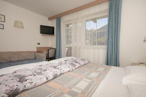 Tempat tidur dalam kamar di Hotel Villa Mozart