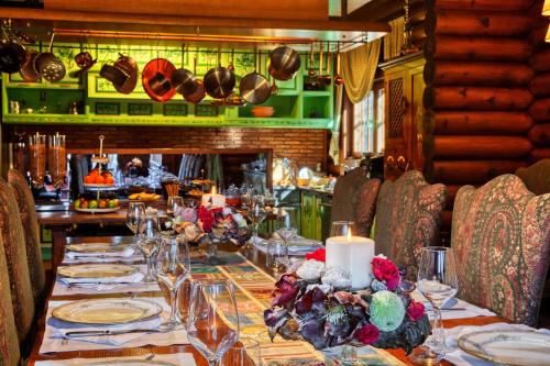 a long table in a restaurant with a fireplace at All Seasons Paradise in Khrisovítsion
