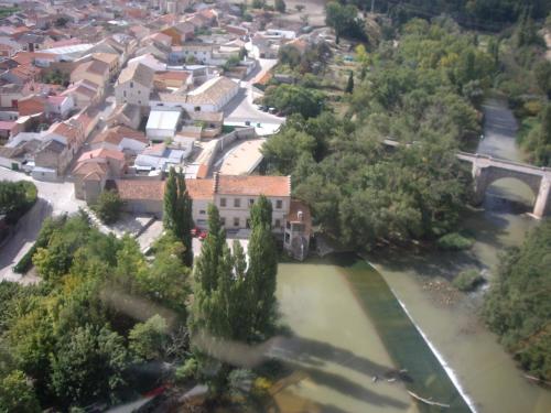 an aerial view of a town with a river at Fuente Aceña Hotel Boutique in Quintanilla de Onésimo