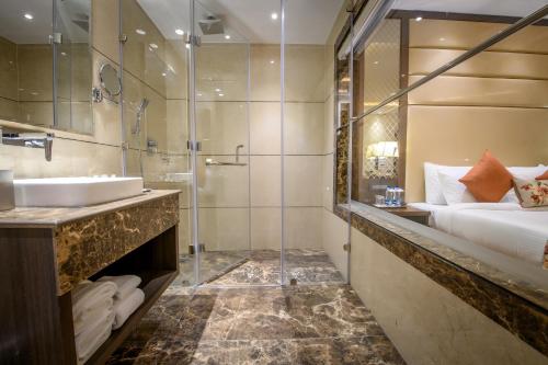 a bathroom with a sink and a shower at Best Western Kapurthala in Kapūrthala