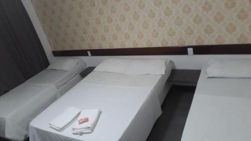 Een bed of bedden in een kamer bij Pousada Mundaú